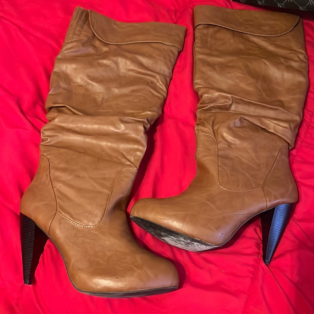Brown pleather below the knee boots.
